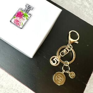 CHANEL beauty line gold CC charms on keychain